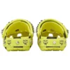Crocs x MCM -camouflage-kuvioiset pistokkaat ”Neon Yellow”